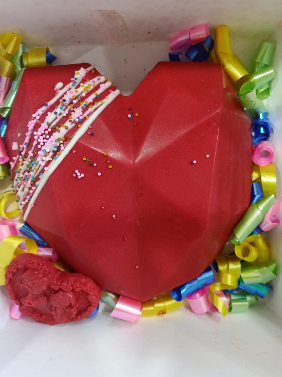 Red heart shape PINATA cake beautifully decorated