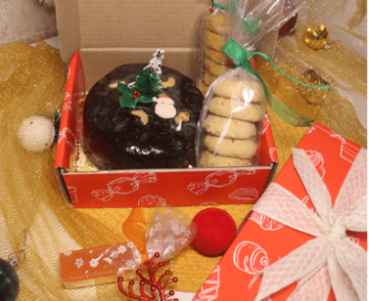 Hamper with plum cake and cookies
