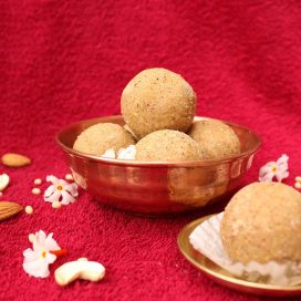 Foxtail millet(thinai) laddu displayed in a copper vessel